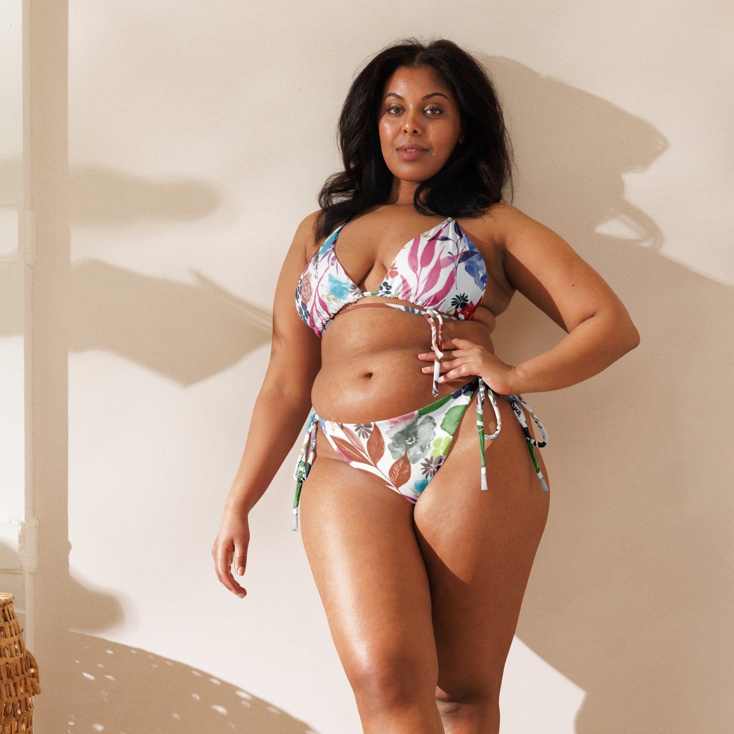 Multicolor Flowers White recycled string bikini. Design hand-painted by the Designer Maria Alejandra Echenique
