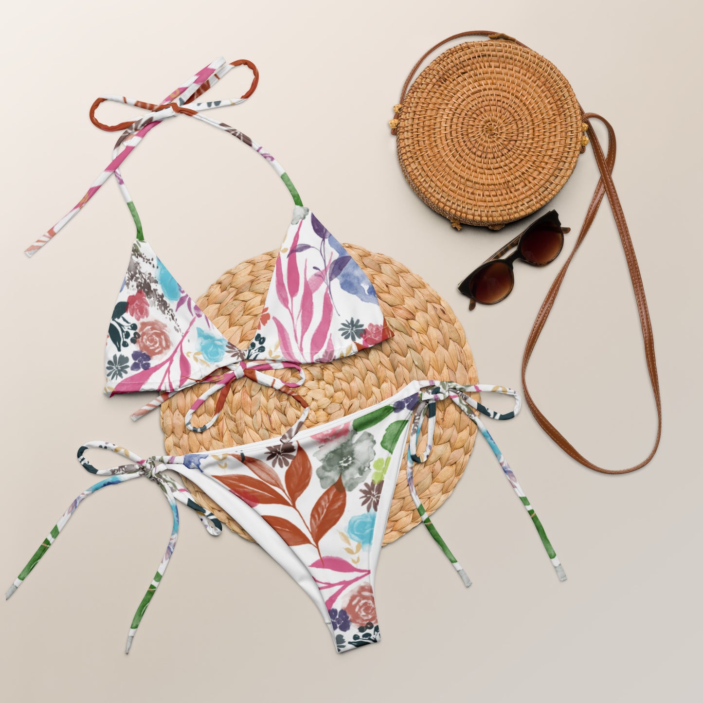 Multicolor Flowers White recycled string bikini. Design hand-painted by the Designer Maria Alejandra Echenique
